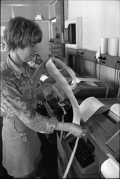 UPI office, telexist at telex terminal.