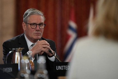 Britain's Prime Minister Keir Starmer listens during the Joint Expeditionary For