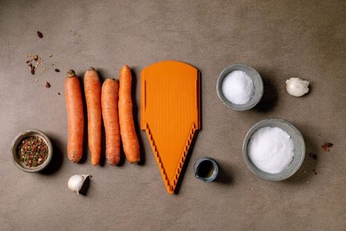 Korean and Asian Cuisine. Ingredients For Preparing Vegetable Salad of the rinated Carrots. Raw Carrots. Seasonings. Grater In Row. Mocha Mousse Color Background. Healthy Cooking. Top View. Space