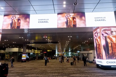 Gabrielle Chanel perfume ad screen panel in Singapore Airport T3 arrivals