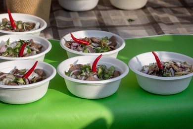 Street Food Festival In Europe. Traditional Vietnamese Pho-bo In Disposable Bowls On Counter. Fast Food Dish from Street Vendor. Hot and Aromatic. Ready To Eat.