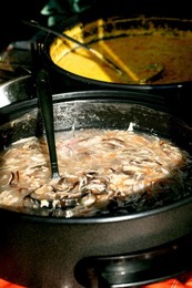 European Street Food Festival. Large Pot Fish Soup With Ladle Inside Ready Serving. Traditional Seafood Broth Aromatic Herbs Visible Chunks Fish Outdoor Market Cooking Steam Rising