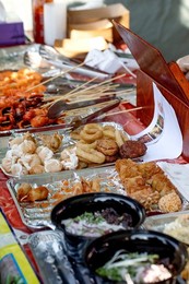 Street Food Festival In Europe. Asian Street Food. Grilled Seafood Skewers On Counter. Fast Food Dish from Street Vendor. Shrimp. Squid. Octopus Ready To Eat.