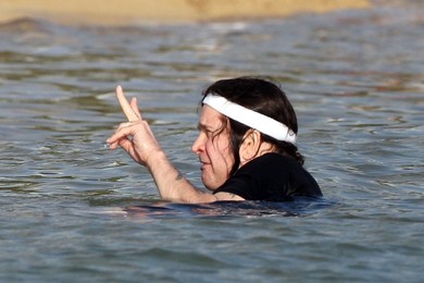 **EXCLUSIVE** Ozzy Osbourne hits the surf as the Osbournes enjoy a family new year vacation in Hawaii