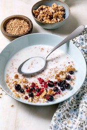 Bowl Yogurt with Sprouted Wheat Walnuts Berries. Nutritious Breakfast with Ceramic Bowls Seeds Nuts. Healthy Meal on White Table with Spoon Textile Napkin