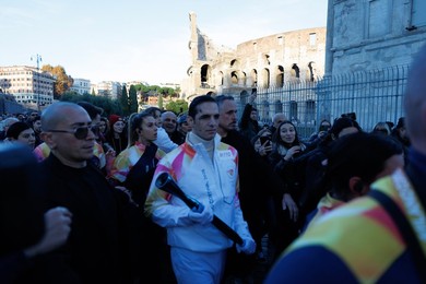 The Olympic Torch departs Rome for the 2026 Milan-Cortina Winter Olympics.
