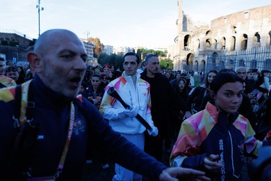 The Olympic Torch departs Rome for the 2026 Milan-Cortina Winter Olympics.