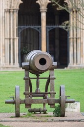 Captured Russian cannon , dating from Victorian times outside  Ely Cathedral ,  Ely, Cambridgeshire, UK.