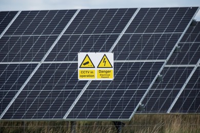 Solar power station and National grid power lines between Soham and wicken, near Ely, cambridgeshire, UK.