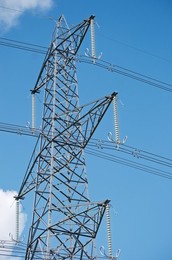 Solar power station and National grid power lines between Soham and wicken, near Ely, cambridgeshire, UK.