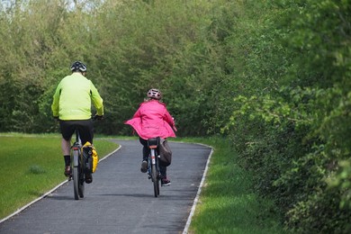 Two cyclists on a recently constructed cycle way between  the villages of Soham and Wicken.
Ely, Cambridgeshire , UK.