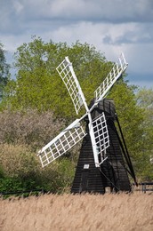 The Wicken Fen wind pump, located in the National Trust's Sedge Fen, is the last remaining working wooden wind pump in the Fens. Built in 1908 by Hunt Brothers of Soham, this small smock mill was moved from Adventurers' Fen and restored in 1956 to help ma