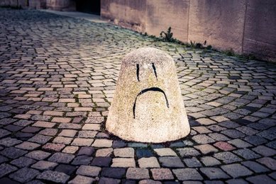 Sad face graffiti